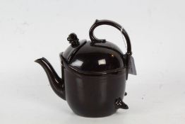 A brown glazed pottery "SYP" teapot, with a scroll handle, 18cm high