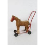 Lines Brothers push-along baby walker, in the form of a horse, original label to underside