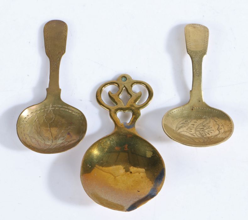 Three 19th century brass caddy spoons, English Two of similar design, engraved, and with fiddle- - Image 2 of 2