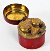 An Victorian tooled leather twin-compartment travelling inkwell, the lid opening to reveal two