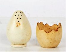 Late 19th century MacIntyre & Co. porcelain pepper and egg cup, the egg cup formed as a broken shell