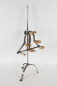 A Wrought iron lark spit, the stem above a adjustable pronged spit raised on tripod legs, 77cm high