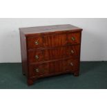 George III style mahogany chest of drawers, consisting of three long drawers, raised on bracket