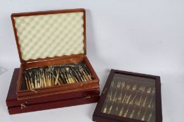 Collection of pickle forks, housed in three wooden cases (qty)