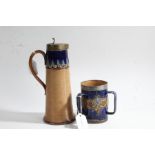 Royal Doulton stoneware ewer, with a pewter lid above a tapering ribbed body with a dark blue