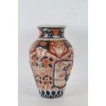 A Large Japanese Imiari vase, the vase of baluster vase with a ribbed body, decorated with floral