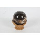 19th Century marble sphere on a modern wooden stand, 10cm high