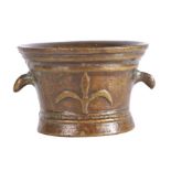 A 17th century style bronze mortar, probably French Cast with a fleur-de-lys, twice, and with two