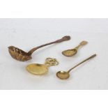 Collection of four spoons to include a 19th century copper sifter spoon, possibly French,