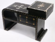 Chinese ebonised and mother-of-pearl inlaid cabinet, the curved top flanked by a hinged compartment,