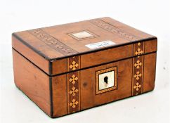 Victorian walnut and marquetry inlaid box, the top decorated with a mother of pearl cartouche and