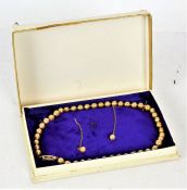 Pearl jewellery set, comprising of a necklace with 9ct gold clasp, and a pair of matching
