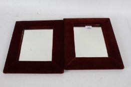 A Pair of wall mirrors with red velvet cushion frames, 33cm by 28cm