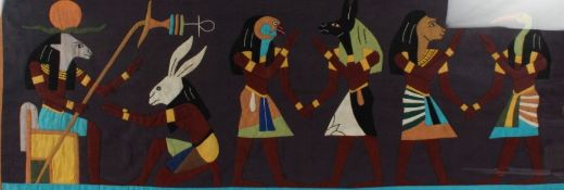 Egyptian revival felt work study of figures, housed in a glazed frame, 125cm wide