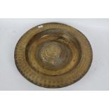 19th century brass "Nuremberg" style alms dish, with a repousse repeating pattern together with