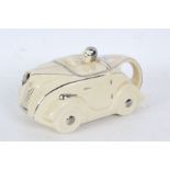 An Art Deco Sadler novelty tea pot in the form of a racing car in cream and chrome, marks to base,