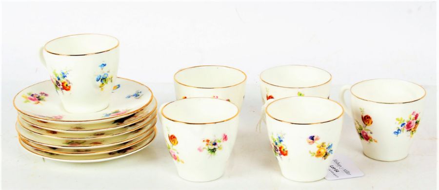 Set of six each Royal Doulton coffee cups and saucers, painted with birds and flowers