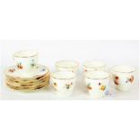 Set of six each Royal Doulton coffee cups and saucers, painted with birds and flowers