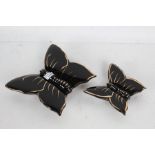 Two 1950s porcelain wall pockets in the form of butterflys in black and gilt, the largest 20cm high