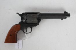 Reproduction Western six shooter, wooden grips, cylinder revolves when cocked