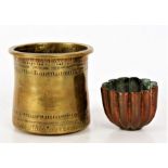 19th century copper jelly mould of gadrooned form, together with a brass pot with a incisewd