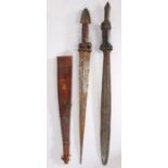 Two African tribal swords, both with leather/hide handles and metal pommels, one with a scabbard,