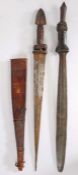 Two African tribal swords, both with leather/hide handles and metal pommels, one with a scabbard,