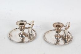 Pair of silverplated chambersticks, by Elkington & Co., each with snuffers, 14.5cm diameter