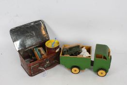 Collection of toys, to include a green painted wooden truck, 'Pick up Monkey' by Lincoln