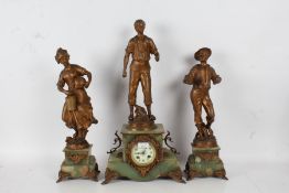A 20th century onyx and gilt metal clock garniture, set with farmers on a onyx and gilt metal