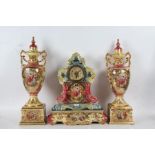 Royal Crown Coronia porcelain mantle clock garniture, decorated with a pink and blue ground set with
