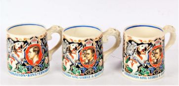 Two Wilkinson coronation mugs, by Dame Laura Knight, commemorating the coronation of King George