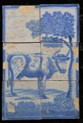 An 18th century Dutch Delft tile panel Designed in blue, with a cow under a tree, 26cm x 39cm