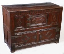 A Charles I joined oak court cupboard base, North Country, circa 1640 Having a triple-boarded and