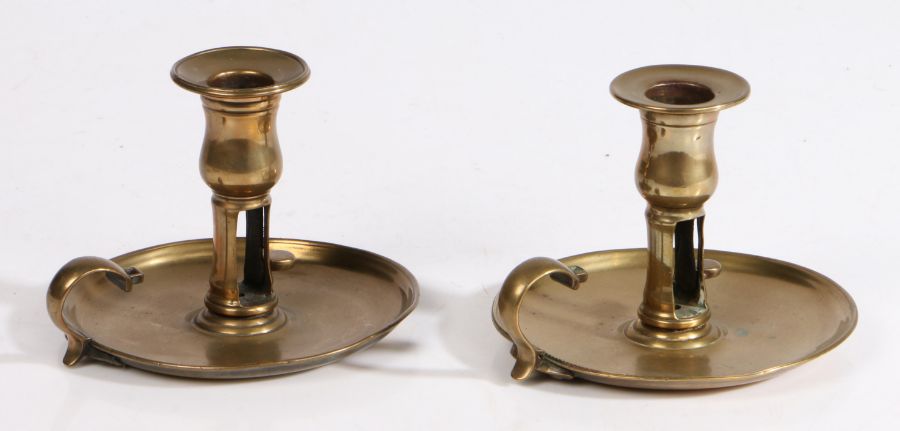 A near pair of George III cast brass chambersticks, circa 1780 Each with tulip-shaped socket with - Image 2 of 2