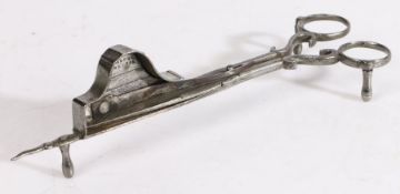 An 18th century iron candle-snuffer, with maker’s mark, English Of scissor form, one blade with a