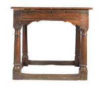 An early 17th century oak box-top table, English, circa 1600-30 Having a hinged triple-boarded top