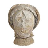 A carved limestone bust, possibly 15th/16th Century Of a female with a hood and black hair, 27cm