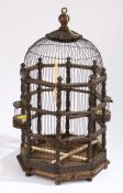 A 19th century bird cage Having an acorn and leaf finial top above a wire frame and acanthus leaf