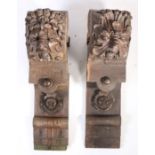 A pair of large 19th century oak corbels, in the 16th century manner Each carved with a Green Man