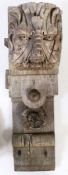 A  large 19th century oak corbel, in the 16th century manner Carved with a Green Man mask, topped by