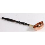 A George III copper toddy ladle The circular bowl inset with a coin dated 1807 to base, the