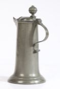 A small pewter flagon, German, circa 1800 Having a plain and splayed drum, the spout with heart-