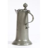 A small pewter flagon, German, circa 1800 Having a plain and splayed drum, the spout with heart-