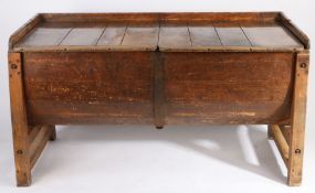 An 19th century fruitwood dough bin The three-quarter gallery back and two removable plank tops