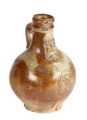 A 17th Century salt glaze Bellarmine jug With a bearded mask above a medallion to the bulbous