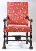 A 17th century walnut, oak and upholstered open armchair, French The rectangular padded back and