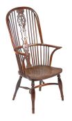 A particularly tall yew Windsor armchair, Buckingham, circa 1800-40 The hooped back with scribed