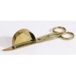 An 18th century brass candle-snuffer, English, circa 1720-50 Of scissor form, one blade with a