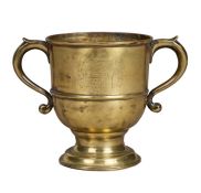 A rare George II engraved brass twin-handled 'loving cup', circa 1740 Of tapering cylindrical